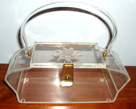 ... clear lucite purse with carved floral lucite top notable for the very